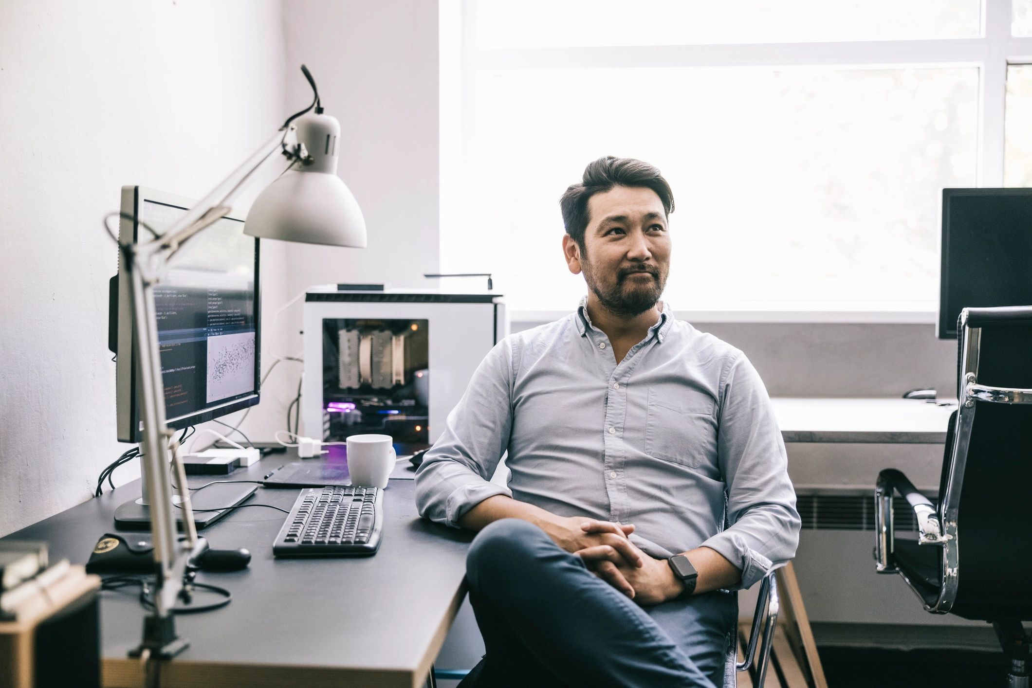 Engineer monitoring system metrics on multiple screens